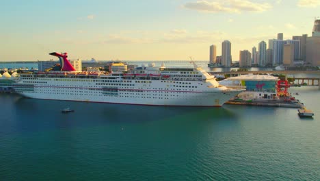 Carnival-Cruise-Ship-in-Port-of-Miami,-Blue-Waters,-Downtown-Miami-Skyline,-Blue-Waters,-Sunset,-Paradise-Vacation-People-traveling-to-Bahamas