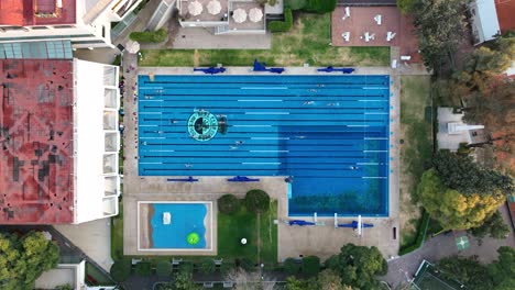 Outdoor-Swimming-pool-at-real-club-espana-sports-complex,-aerial