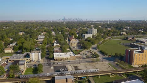 Cinematic-Aerial-View-of-Subway-Train-on-Chicago's-South-Side-in-Summer