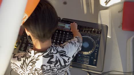 Dj-playing-music-on-a-wedding-party-on-a-catamaran-sail-boat