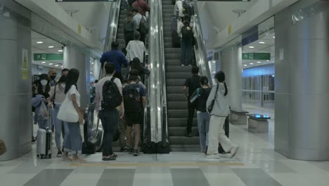 arrive-at-subway-metro-train-station-in-airport-using-escalator
