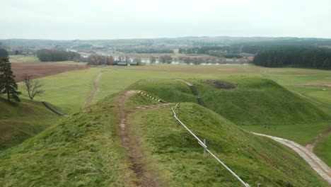 AERIAL:-Flying-of-Top-of-Mound-in-Kernave-Archaeological-site-on-a-Gloomy-Autumn-Day