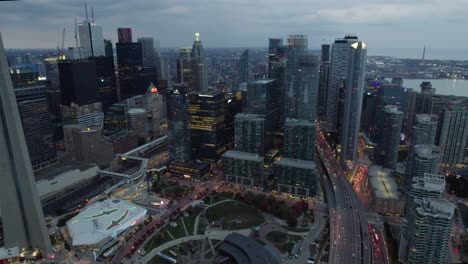Aerial-view-of-the-railway-museum-and-buildings-in-South-Core,-Toronto,-gloomy-fall-evening-in-Canada---pull-back,-drone-shot