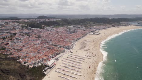 Aerial-circular-view-of-wide-Nazarè-beach