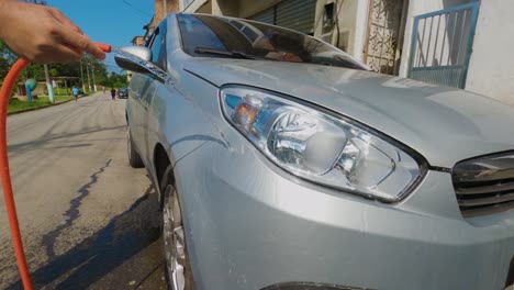 Angra-dos-Reis,-Rio-de-Janeiro,-Brazil---October-17,-2022-Washing-the-car-on-a-sunny-day