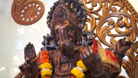 ganpati-statue-of-Indian-god-dark-stone-slow-motion