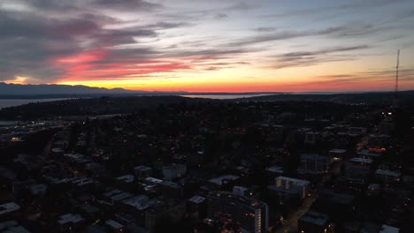 Aerial-view-of-the-sun-setting-over-Seattle's-Queen-Anne-neighborhood
