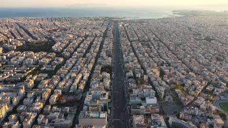 City-center-of-Athens-skyline-and-seascape,-aerial-view-at-sunrise-time