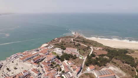 Nazare-village-and-famous-beach-with-sea-in-background,-Portugal