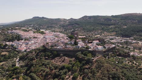 Aerial-orbiting-around-Castelo-de-Vide-fortress-and-surrounding-landscape,-Portugal