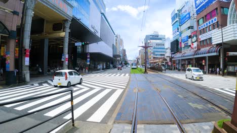 POV-of-Tram-driving-through-Tenmonkan-in-Kagoshima,-Japan