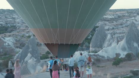 Hot-air-balloon-rises-close-to-amazed-onlookers