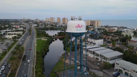 Jacksonville-Beach-FL-Water-Tower-and-A1A-at-Dusk---Aerial-Orbit-Descending-Slow