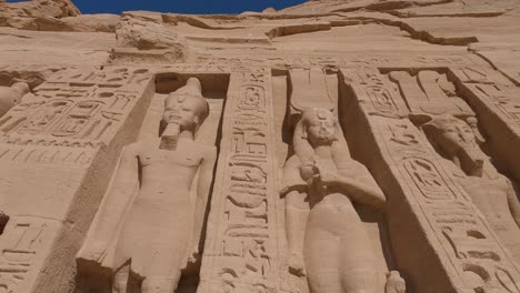 Close-up-shot-of-the-large-statues-engraved-into-the-front-of-the-Abu-Simbel-Temple