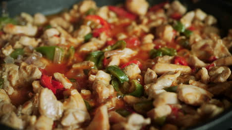 Homemade-fajita-mix-simmering-in-a-frying-pan---bell-peppers,-chicken,-beans,-spices,-onion-recipe
