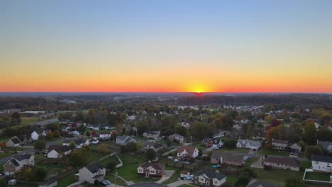 Panoramic-View-Of-Town-At-Sunset-With-Magnificent-Colorful-Sky-And-Warm-Light---aerial-drone-shot