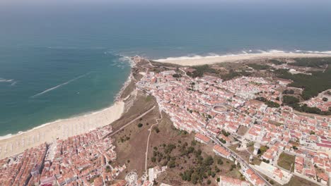Panoramic-of-Nazare-beach-and-town,-Silver-Coast,-Portugal