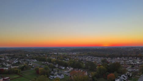 Aerial-View-Of-Suburban-Houses-In-Sunset---drone-shot