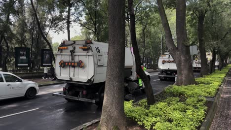 shot-of-cleaning-trucks-doing-their-work-in-a-park-in-mexico-city