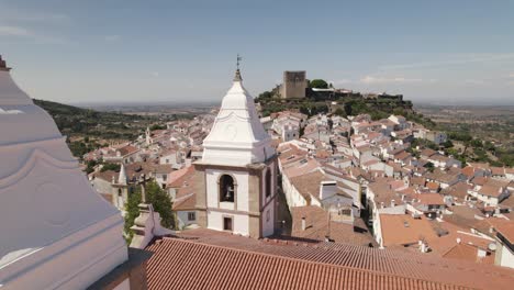 White-bell-towers-of-Church-Igreja-Matriz-de-Santa-Maria-da-Devesa,-Castelo-do-Vide,-Portugal