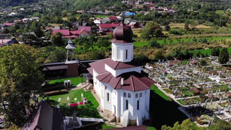 Drone-Aerial-Over-Orthodox-Church-In-Romania-Sunny-Countryside