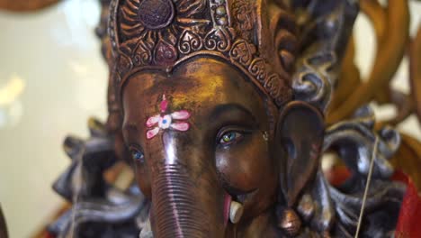 ganpati-statue-of-Indian-god-dark-stone-slow-motion-face-close-up