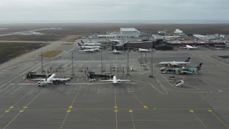 Reykjavik-airport-in-Iceland-during-cloudy-day,-aerial