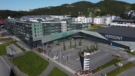 Horisont-shopping-mall-exterior-at-summer-day-before-opening-hours---Sunny-day-aerial-from-district-outside-Bergen-Norway
