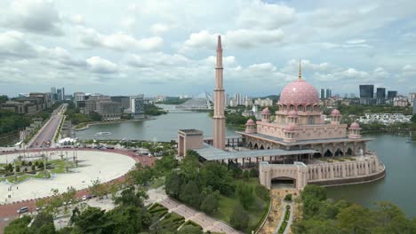 Aerial-drone-shot,-side-view-of-Putra-Mosque-or-Masjid-and-Putra-Square