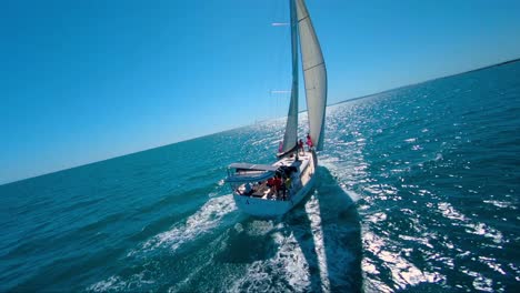 FPV-aerial-view-of-a-sail-boat-that-is-sailing-through-the-mediterranean-sea-in-southern-france