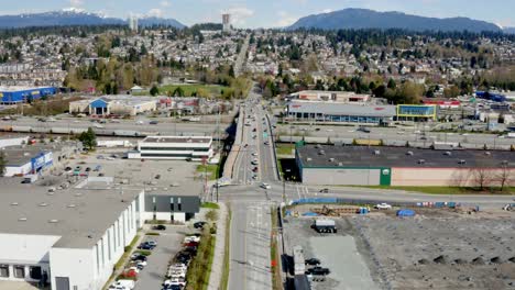 Aerial-View-Of-King-Edward-Street-Overpass-And-Trans-Canada-Highway-With-Nearby-Business-Buildings-In-Coquitlam,-BC,-Canada