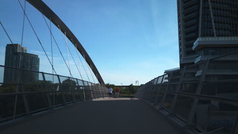 Wide-shot-cycling-across-the-Garrison-Crossing-south-bridge
