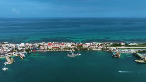 Aerial-view-of-boats-and-ferries-at-the-Isla-Mujeres-marina,-in-sunny-Mexico