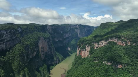 Aerial-view-over-tourists-at-a-viewpoint-at-the-Grijalva-river-and-the-Sumidero-Canyon-n-sunny-Chiapas,-Mexico
