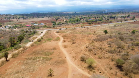 Aerial-reveal-of-asphalt-roads-in-a-beautiful-rural-landscape-in-Kenya