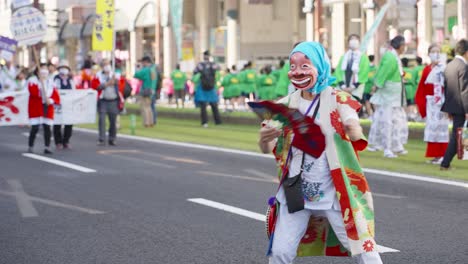Japanese-dancer-with-funny-mask-dancing-in-street-with-fan---Ohara-Festival