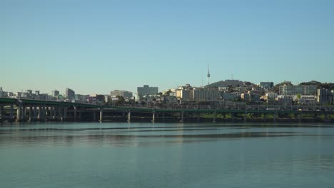 The-Yongsan-gu-Tower-and-Seoul-City-skyline-as-seen-from-the-across-the-Hangang-River-on-a-clear-day