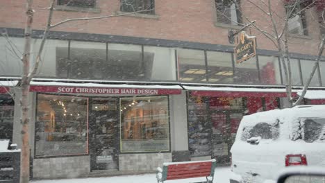 View-of-storefronts-during-a-snow-storm-in-Boise,-Idaho