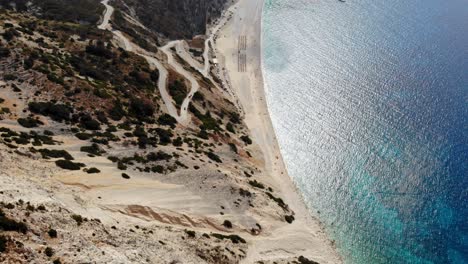 Top-View-of-the-Turquoise-Colored-Sea-of-the-famous-Myrtos-Beach-on-the-Greek-Island-of-Kefalonia---aerial-drone-shot