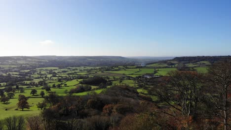 Beautiful-forward-aerial-shot-over-the-East-Devon-Countryside-from-Dumpdon-Hill-in-the-Blackdown-Hills-England-UK