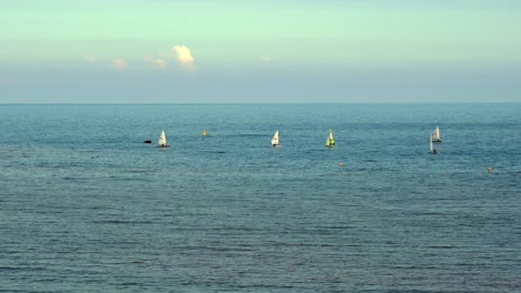 Small-sailing-boats-sail-on-the-English-Channel-in-Sidmouth-Devon-England