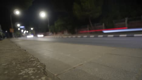 Busy-city-street-time-lapse-at-night-with-cars-speeding-by
