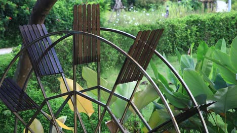 4K-Waterwheel-Spinning-Slowly-Close-up-with-Wooden-Paddles-and-Metal-Frame