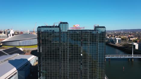 Drone-shot-lifting-up-over-Glasgow-Crown-Plaza-Hotel-to-see-Glasgow-cityscape