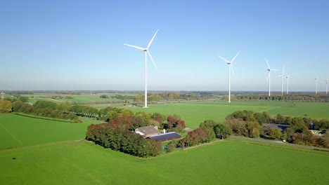 Aerial-drone-view-at-the-wind-turbine-farms-in-the-countryside-of-the-Netherlands,-Europe