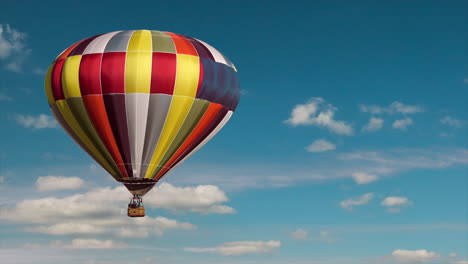 Hot-air-balloon-flying-high-in-sky,-colorful-airship,-travel,-flight,-transportation,-aircraft,-sky-replacement-effect