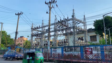View-Of-Electricity-Substation-In-Sylhet-Beside-Road-With-Traffic-Going-Past