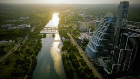 Google-building-and-the-Lady-Bird-Lake,-sunset-in-Austin,-Texas,-USA---Aerial-view