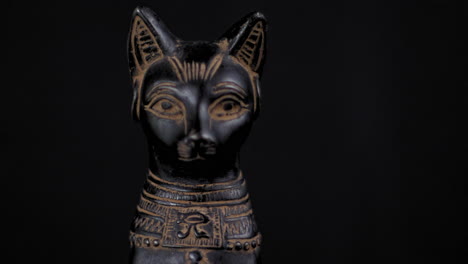 Dolly-of-a-small-replica-Egyptian-Statue-of-Bastet---Facing-Forward---Close-Up-Right-to-Left