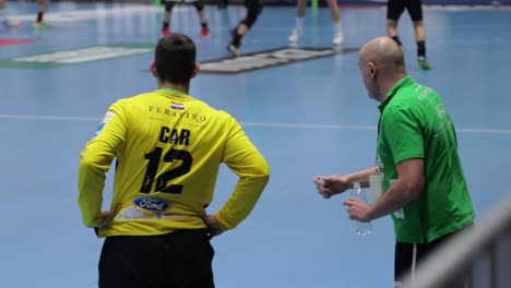 Handball-Match,-Man,-SEHA,-Europe,-the-coach-advises-the-goalkeeper